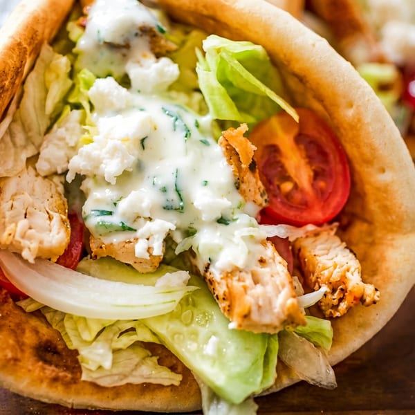 Grilled chicken pita filled with fresh lettuce, tomato, onion, creamy sauce, and crumbled feta.